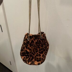 Gold chained leopard print hand bag